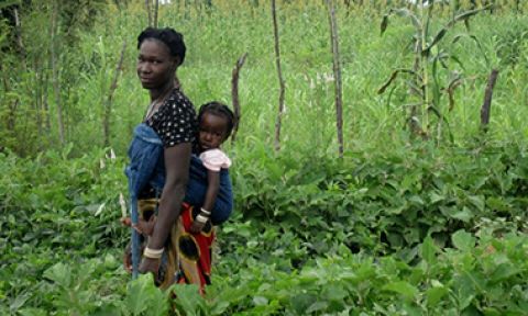Mother and child in home garden, Burkina Faso