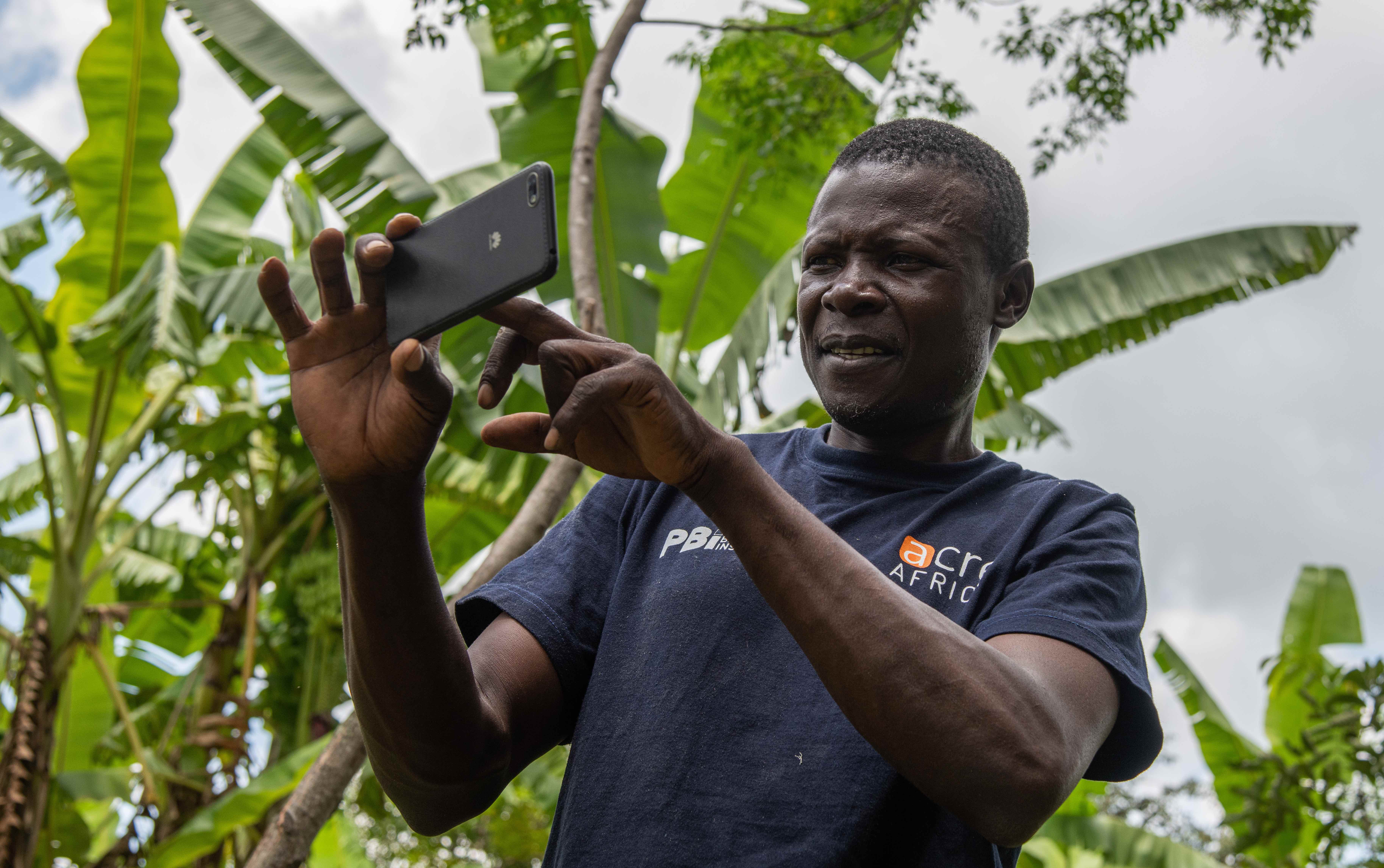 Man pointing smartphone to take picture