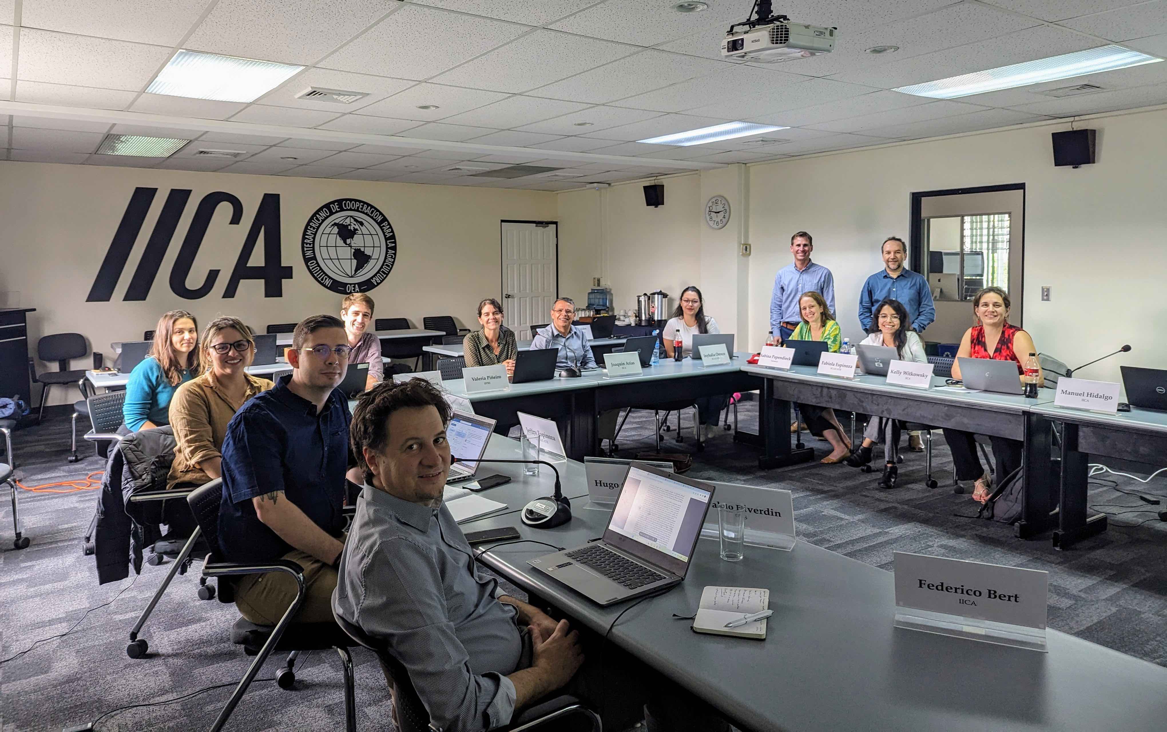 Participants sitting around a u-shaped table
